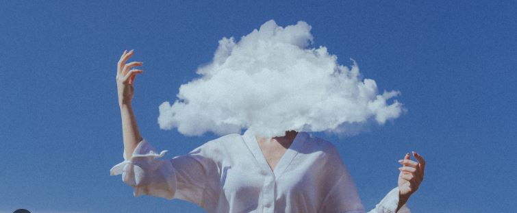 Person with head in a cloud